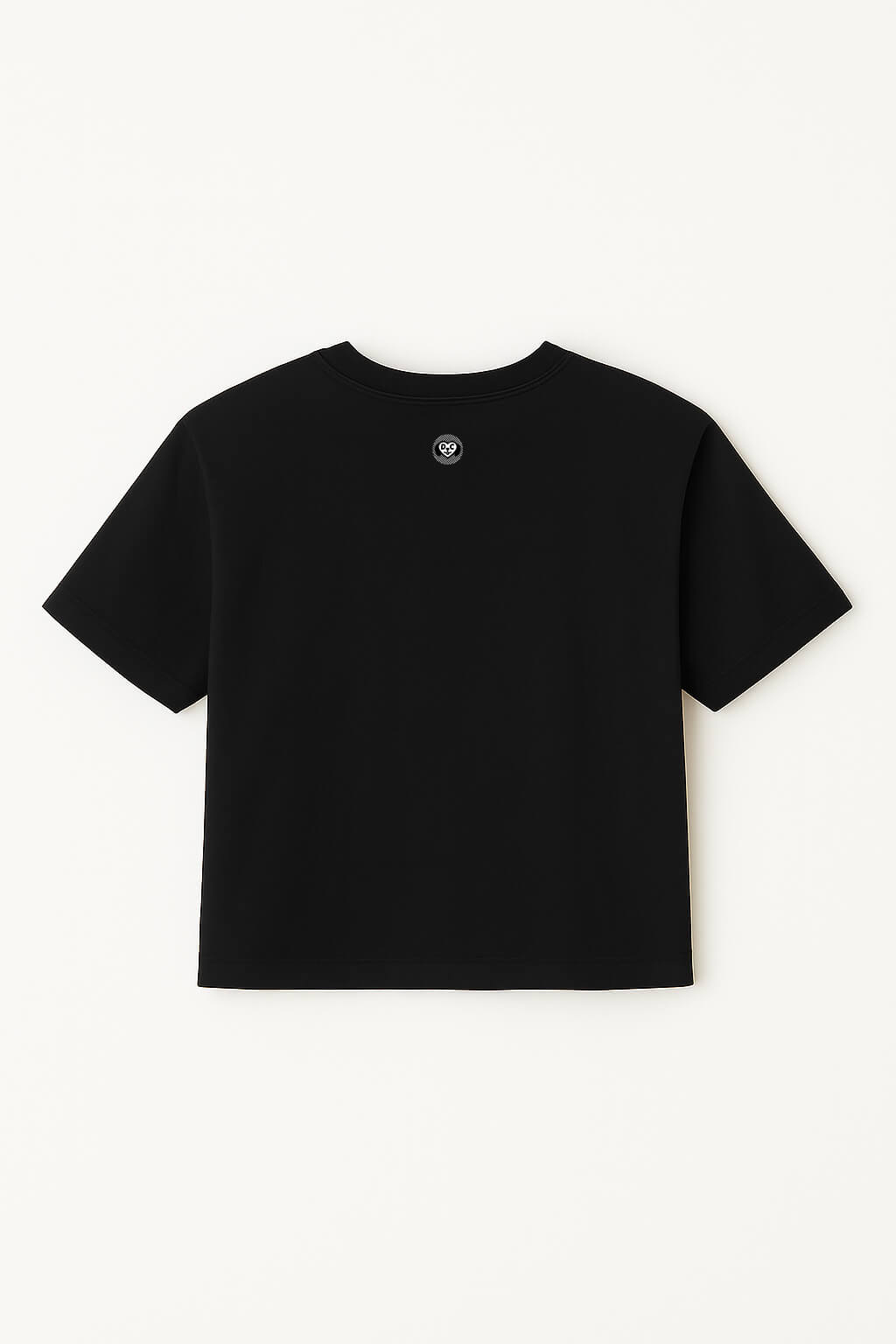 The Oversized Dog Mom Crop Top by Dogloverclothing.com is a relaxed fit black crop top with a small circular logo on the upper back, perfect for showing off your dog mom pride.