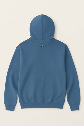 The Dog Mom Hoodie by Dogloverclothing.com is shown from the back, with a small round black and white paw-print logo below the hood, set against a plain light background.