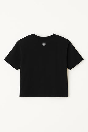 The Oversized Dog Mom Crop Top by Dogloverclothing.com is a relaxed fit black crop top with a small circular logo on the upper back, perfect for showing off your dog mom pride.