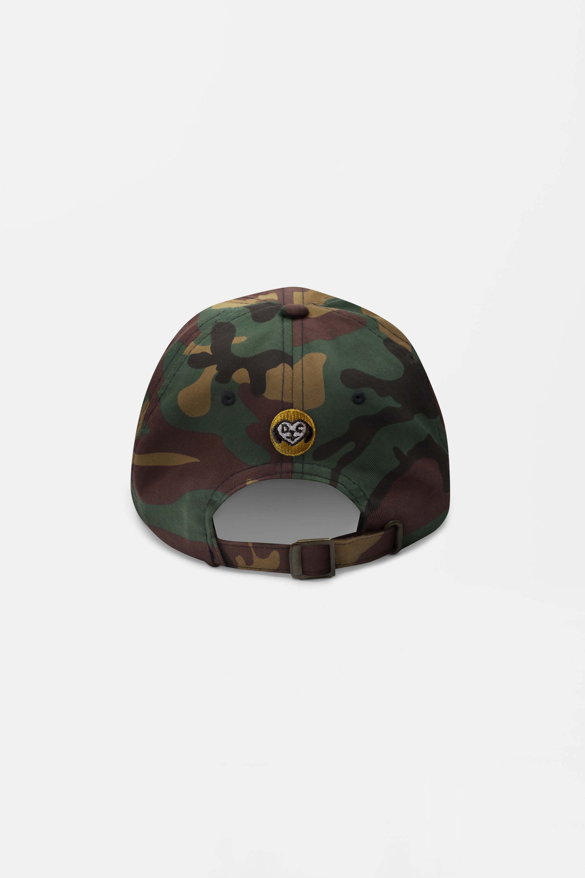 The Iconic Corgi Cap by Dogloverclothing.com is a camouflage baseball cap with an adjustable strap and a small circular patch featuring a corgi above the strap. Shown from the back on a plain white background—perfect for adding Corgi cuteness to your look.