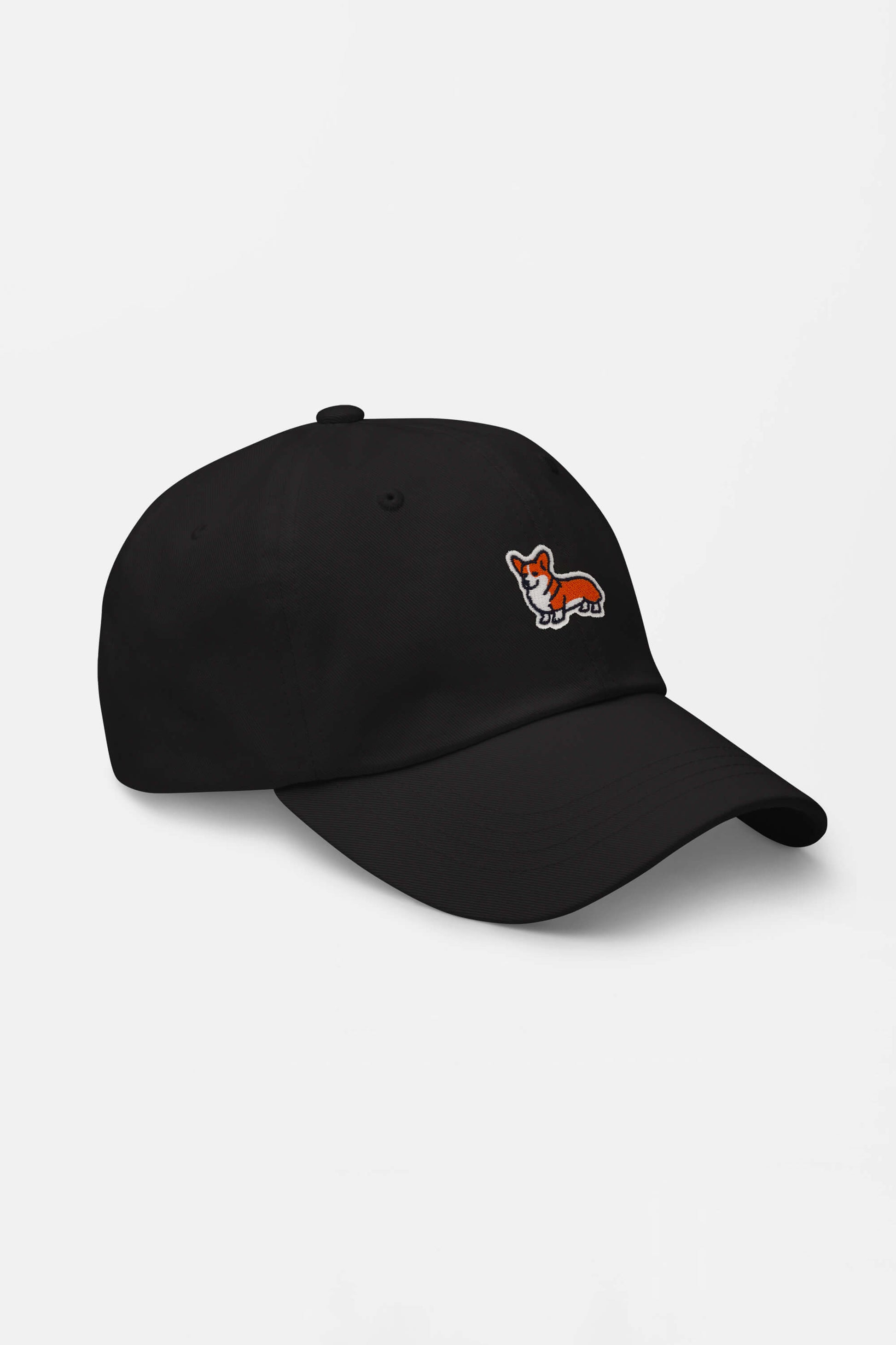 The Iconic Corgi Cap by Dogloverclothing.com features a small embroidered orange and white corgi on classic black—perfect for fans of adorable pups. Displayed on a plain white background.