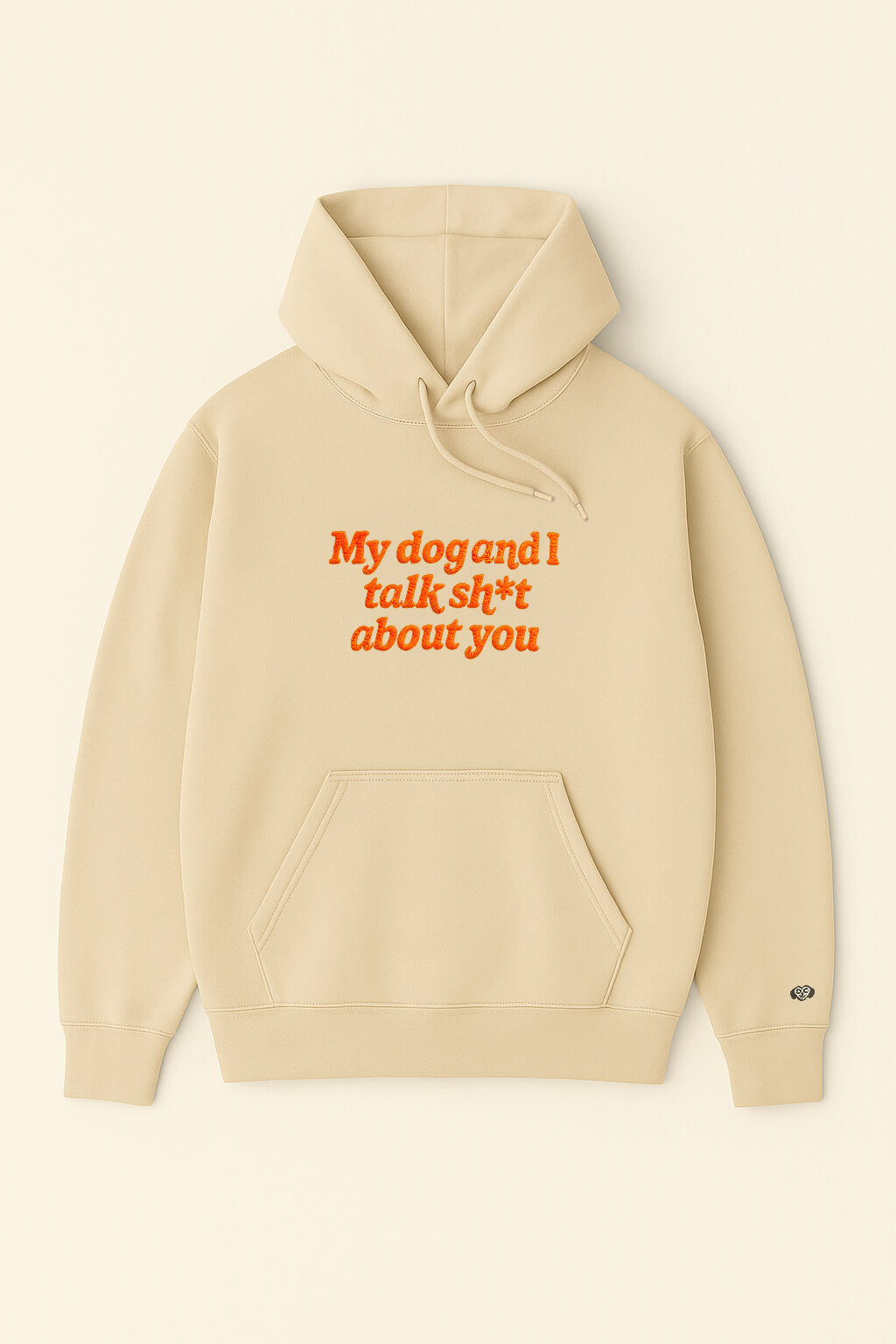 The Bold My Dog And I Talk Embroidered Hoodie from Dogloverclothing.com is a beige, classic-fit hoodie with a front pocket and My dog and I talk sh*t about you embroidered in orange on the front.