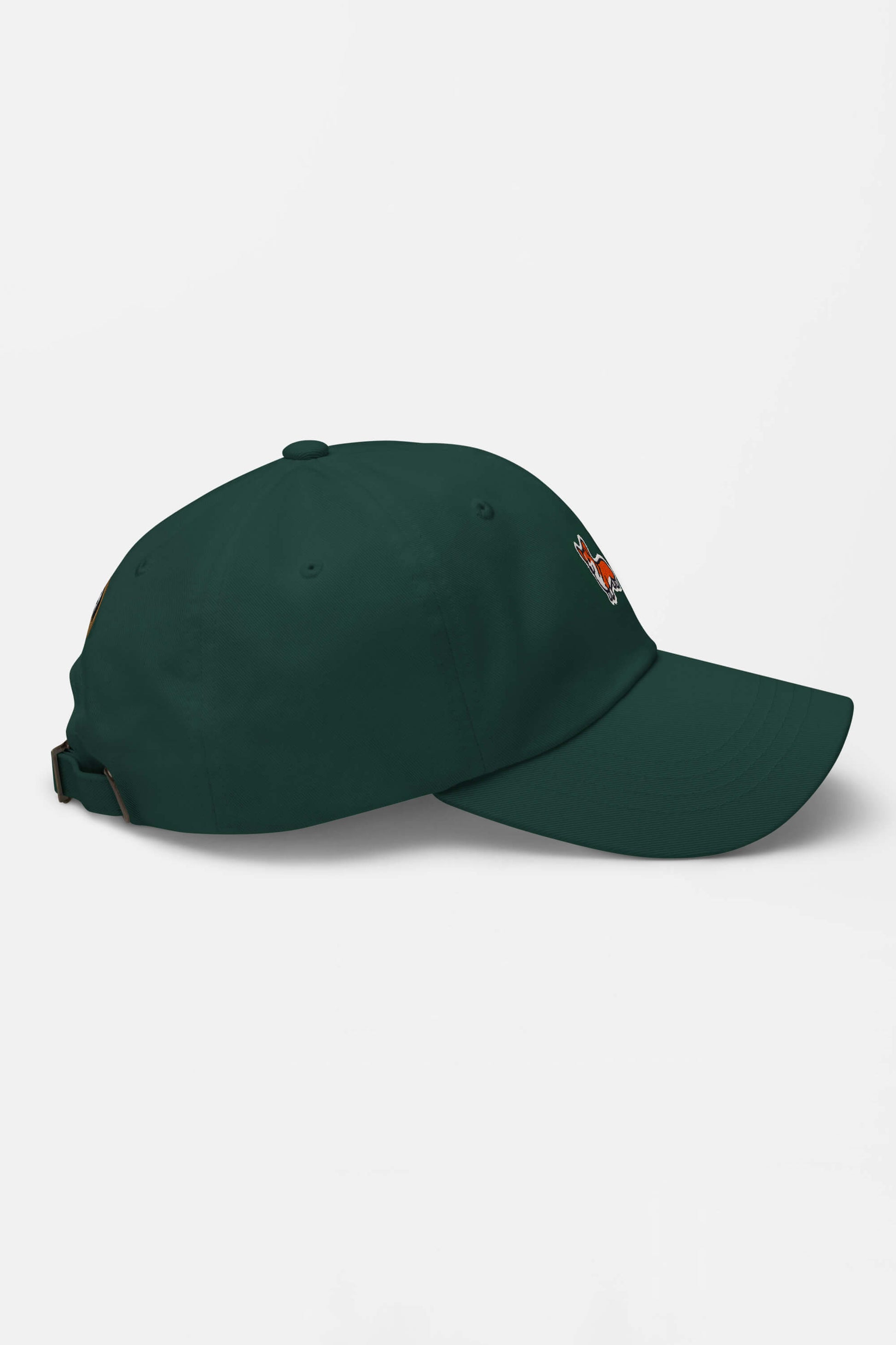The Iconic Corgi Cap by Dogloverclothing.com features a dark green color and a small, colorful embroidered side graphic of corgi cuteness, displayed from a side angle on a plain white background.